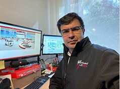 Juan Amado in his home office in Colombia